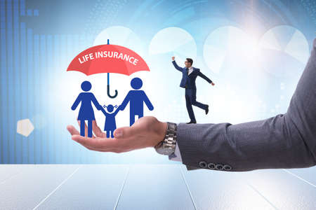 Life insurance concept with family under umbrellaの写真素材