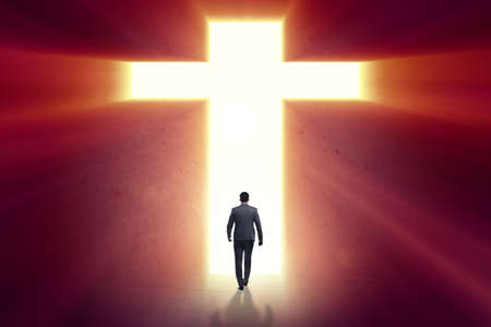 Religious concept with cross and lonely manの写真素材