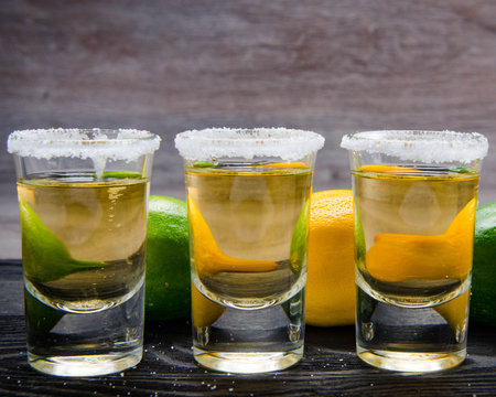 Tequila drink served in glasses with lime and saltの写真素材
