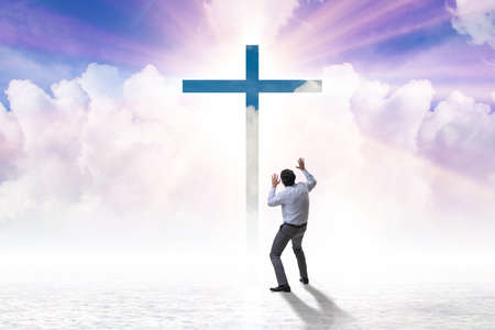 Religious concept with cross and lonely manの写真素材