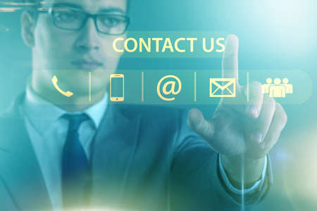 Businessman pressing in communication conceptの写真素材