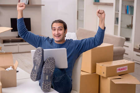 Young man moving to new flat