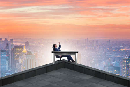 Businessman self isolating on the topの写真素材