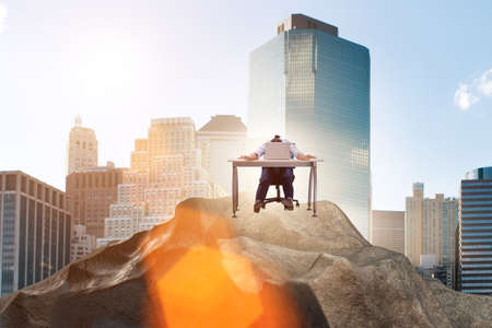 Businessman self isolating on the topの写真素材