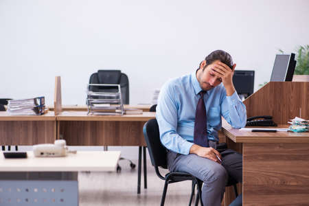 Young male employee working in the officeの写真素材