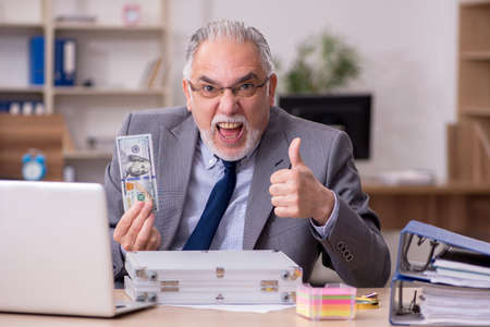 Old male employee in remuneration concept