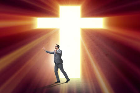 Religious concept with cross and lonely manの写真素材