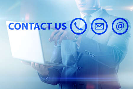 Businessman pressing in communication conceptの写真素材