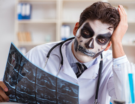 Scary monster doctor working in labの写真素材