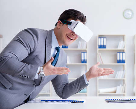 Businessman with virtual reality glasses in the office
