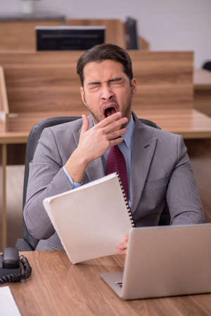 Young businessman employee working in the officeの写真素材