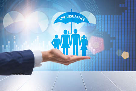 Life insurance concept with family under umbrellaの写真素材