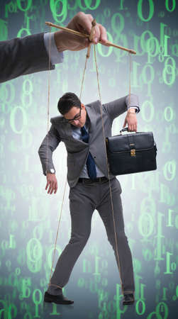Businessman puppet being manipulated by bossの写真素材