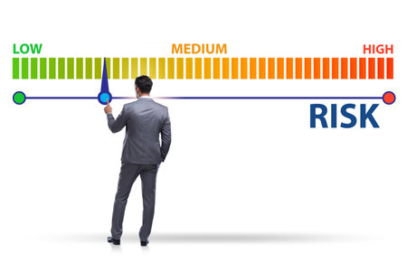 Businessman in risk metering and management conceptの写真素材