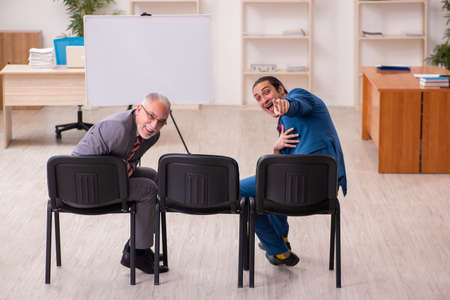 Two male employees in business meeting conceptの写真素材