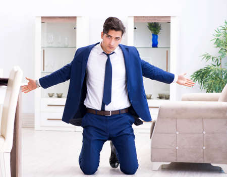 Bankrupt businessman angry and upset at homeの写真素材