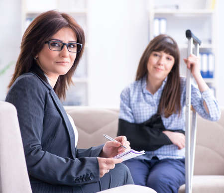Injured woman visiting phychologist for adviceの写真素材