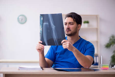 Young male doctor working in the clinicの写真素材