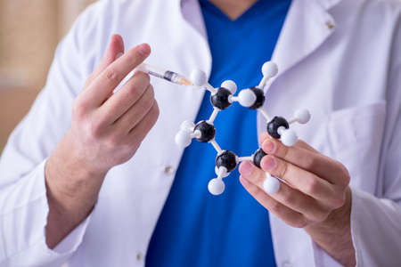 Young male doctor in vaccination conceptの写真素材