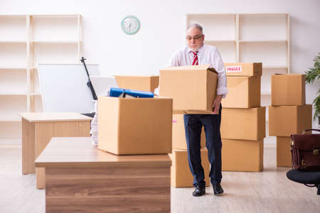 Old businessman employee in relocation conceptの写真素材