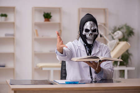 Devil doctor working in the clinic