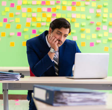 Businessman with many conflicting prioritiesの写真素材