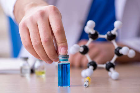 Young male doctor in vaccination concept
