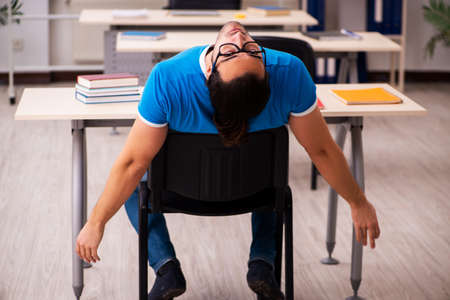 Young male student in the classroomの写真素材