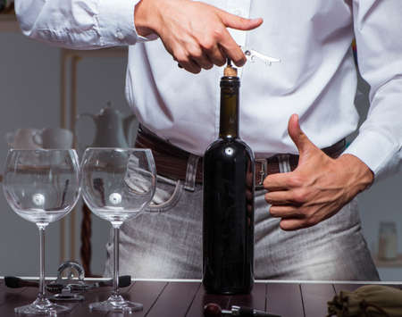 Professional sommelier tasting wine in restaurantの写真素材