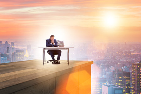 Businessman self isolating on the topの写真素材
