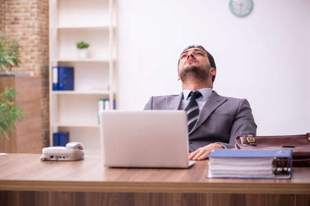 Young businessman employee working in the officeの写真素材