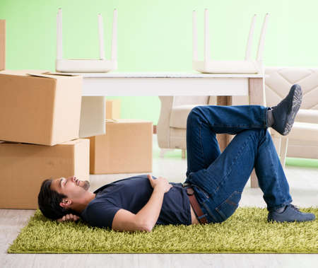 Man moving house with boxesの写真素材