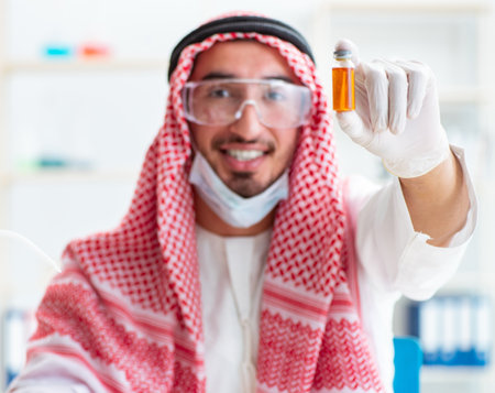 Arab chemist working in the lab officeの写真素材