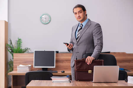 Young male employee working in the officeの写真素材