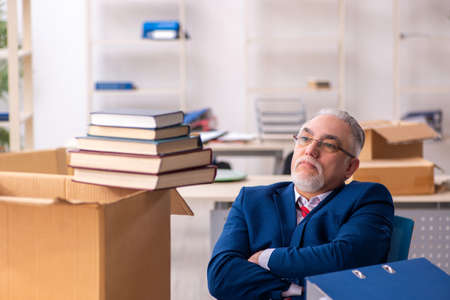 Old male employee in movement conceptの写真素材