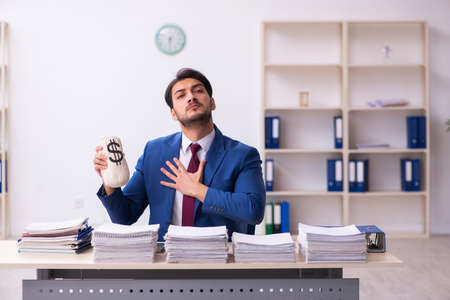 Young businessman employee in remuneration conceptの写真素材