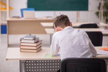 Boy sitting in the classromの写真素材