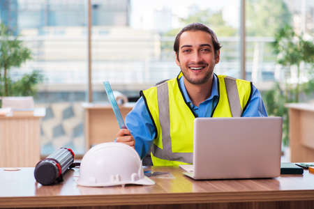 Young male architect working in the officeの写真素材