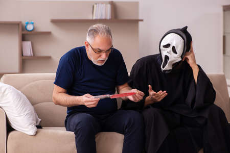 Devil visting old dying man at home