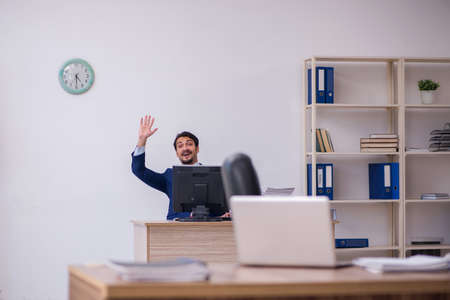 Two male employees working in the office