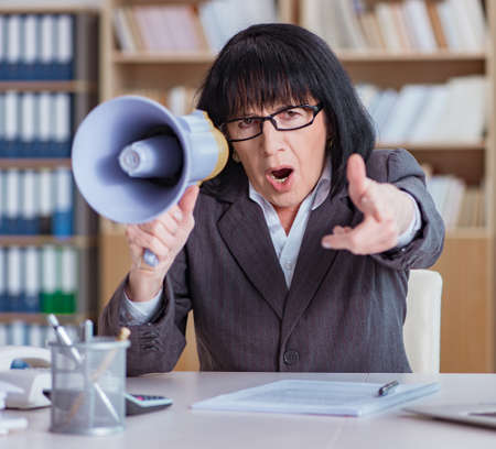 The mature businesswoman working in the officeの写真素材