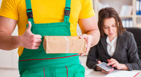 Postman delivering parcel to the office