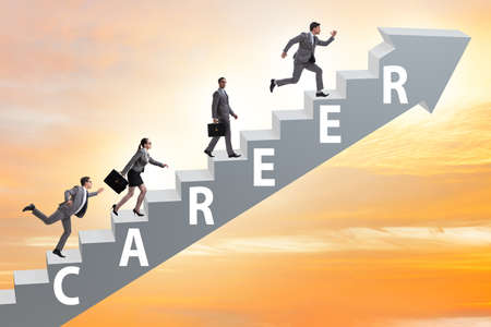 Business people climbing career ladder in business conceptの写真素材
