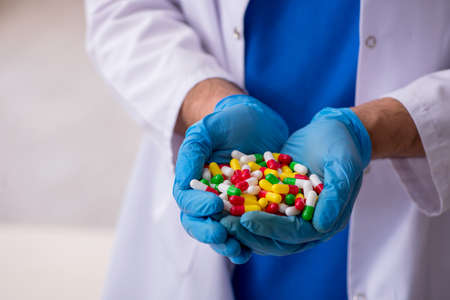 Young male doctor and too many pills