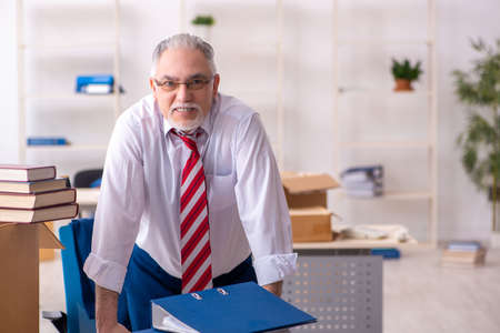 Old male employee in movement conceptの写真素材