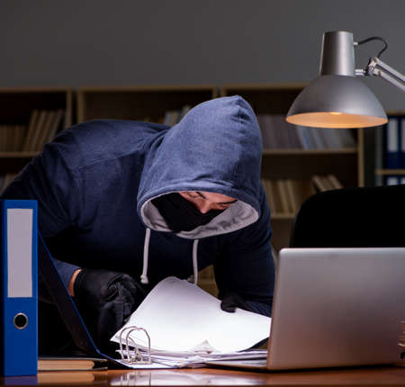 Hacker stealing personal data from home computerの写真素材