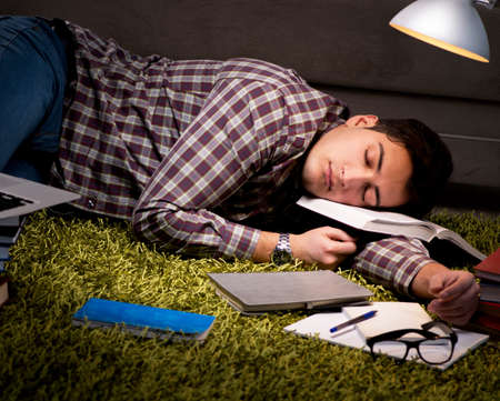 Student reading books preparing for exams