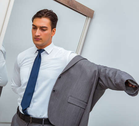 Businessman dressing up for work