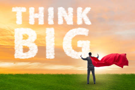 Think big concept with businessman superheroの写真素材