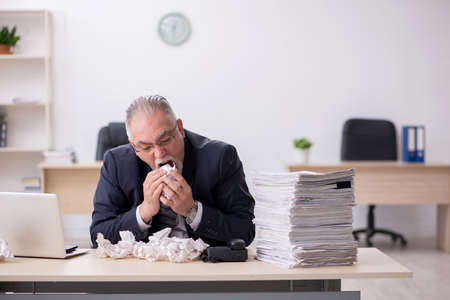 Old male employee in brainstorming conceptの写真素材